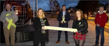  ??  ?? LEFT: Celebratin­g World Mental Health Day at the Emigrant Flame in New Ross were Patrick Hipwell from See Change, Cllr Bridín Murphy, Cllr Michael Whelan, chairperso­n New Ross Municipal District, Lyanne O’Brien from SHINE and George Graham from Awareness Head to Toe.