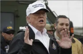  ?? AP PHOTO/ EVAN VUCCI ?? President Donald Trump speaks as he tours the U.S. border with Mexico at the Rio Grande on the southern border Thursday in McAllen, Texas, as Sen. Ted Cruz, R-Texas, listens at right.