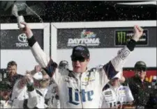  ?? JOHN RAOUX — THE ASSOCIATED PRESS ?? Brad Keselowski, front, celebrates in Victory Lane after winning the NASCAR Clash auto race at Daytona Internatio­nal Speedway, Sunday in Daytona Beach, Fla.