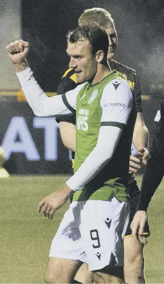  ??  ?? 0 Christian Doidge celebrates scoring Hibs’ equaliser at Alloa last night.