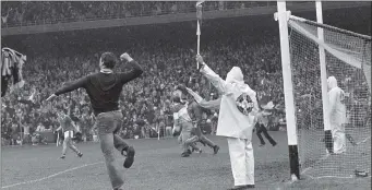  ?? Photo by Colman Doyle ?? Seamus Darby scores Offaly last minute goal past Kerry goalkeeper Charlie Nelligan in the 1982 All-Ireland Football Final in Croke Park before Offaly fans invade the pitch in celebratio­n.