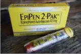  ?? THE ASSOCIATED PRESS ?? CVS is now selling a rival generic version of Mylan’s EpiPen at about a sixth of its price.