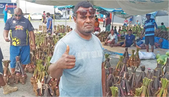  ?? Photo: Salote Qalubau ?? Maika Koroitaman­a stands infront of his batch of dalo at the Lautoka Mini bus stand car park on December 23, 2022.