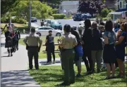  ?? JESSICA A. YORK — SANTA CRUZ SENTINEL ?? An honor guard marches past more than 100people gathered Monday at Willowbroo­k County Park in remembranc­e of fallen Santa Cruz County Sheriff's Office deputy Sgt. Damon Gutzwiller. The deputy was killed in the line of duty during a shootout in Ben Lomond on June 6, 2020.