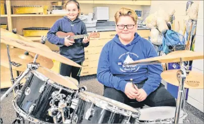  ?? RYAN ROSS/THE GUARDIAN ?? Grade 6 students Kayla MacDonald, left, and Jaxsen Carragher display some of Stratford Elementary School’s instrument­s like the ones that will soon be rolling out across the province as part of a $300,000 purchase.