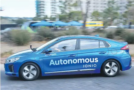  ?? — GETTY IMAGES ?? Passengers take a ride in Hyundai’s Autonomous IONIQ at the CES in Las Vegas last week. Being driven around by your own car eventually becomes very relaxing, according to Clayton Seams.