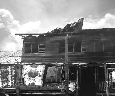  ??  ?? One of the units at Rumah Lasah Mering, where the roof was damaged by strong winds during the Wednesday night storm.