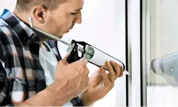  ?? DREAMSTIME ?? Sealing windows with caulk is an easy and effective way to prevent drafts.