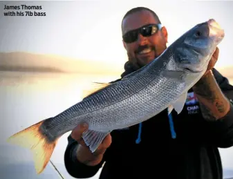  ??  ?? James Thomas with his 7lb bass