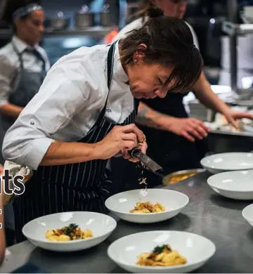  ??  ?? Compton in the kitchen at her Compère Lapin in New Orleans. — Compère Lapin photo