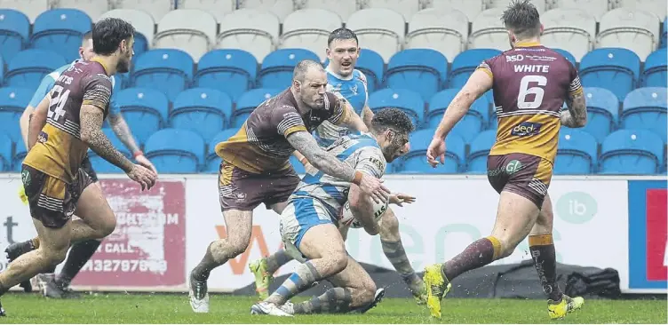  ?? ?? James Woodburn-Hall goes over for Halifax’s second try against Batley Bulldogs last Sunday. Photo by Simon Hall.