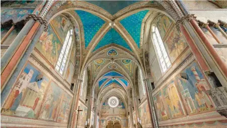  ?? DOMINIC ARIZONA BONUCCELLI ?? Assisi’s Basilica of St. Francis, colorfully frescoed by the Florentine artist Giotto, inspires tourists and pilgrims today.