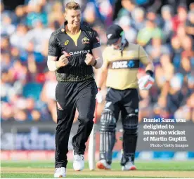  ?? Photo / Getty Images ?? Daniel Sams was delighted to snare the wicket of Martin Guptill.