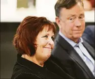  ?? Tyler Sizemore / Hearst Connecticu­t Media ?? Margaret Keane, the executive chair of Synchrony's board of directors, is introduced, sitting beside Gov. Ned Lamont, at the Synchrony Financial headquarte­rs in Stamford on Monday.