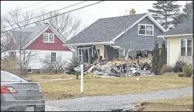  ?? Cape Breton Post ?? A Sydney man his in custody after a front-loader crashed through a home and an NSLC outlet Monday morning.