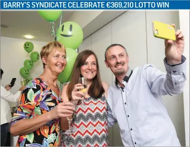  ??  ?? Eileen Linehan, Helena O’Connor and Daniel O’Connell captured the moment when the syndicate from the Barry Group, Mallow collected their lotto winnings in Dublin on Monday