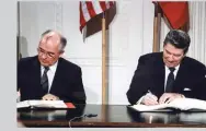  ??  ?? PHOTO: Ronald Reagan and Mikhail Gorbachev sign the Intermedia­te-range Nuclear Forces Treaty (1987)
© White House Photo