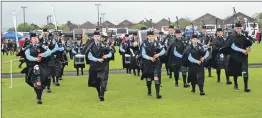  ?? Photograph: Gilbert McKillop. ?? KSPB took to the field at 10.20am under the leadership of Pipe Major Fiona Mitchell, left.