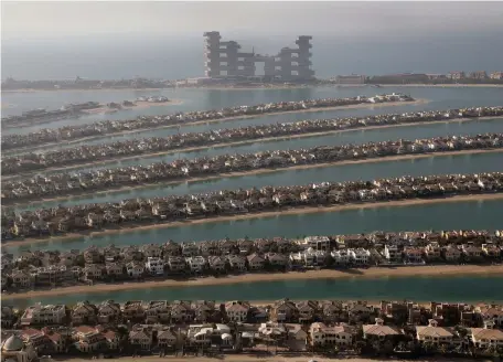  ?? AP ?? The Palm Jumeirah, developed by Nakheel. The merger with Meydan under Dubai Holdings is a pivotal event, experts say