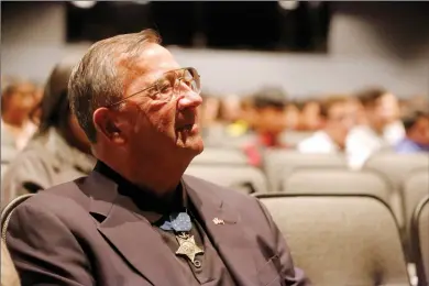  ?? Nikolas Samuels/ The Signal (See additional photos at signalscv.com) ?? (Above) Medal of Honor recipient Col. Jay Vargas watches a video about his experience at Vietnam and the battle at Dai Do at Golden Valley High School on Thursday. He is one of only 71 Medal of Honor recipients still alive and gave a speech to some 300...