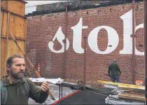  ?? STEVE SCHOONOVER — ENTERPRISE-RECORD ?? Building owner Matt Theide of Chico stands in front of bricks painted with the Stoble Coffee name in December 2019 as the new building takes shape.