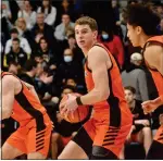  ?? KYLE FRANKO — TRENTONIAN PHOTO ?? Princeton’s Cade Pierce, center, grabs a rebound against Columbia during an NCAA men’s basketball game at Levien Gym in New York. Pierce was named Ivy League Player of the Year on Wednesday.