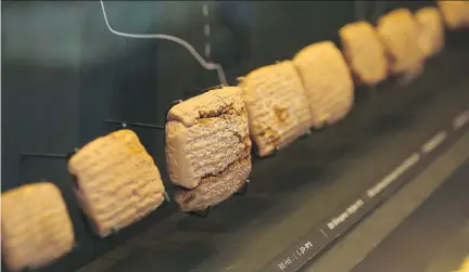  ??  AVI NOAM/BIBLE LANDS ?? Cuneiform tablets, one of the world’s earliest scripts, are shown on display at the Bible Lands Museum Jerusalem. The tablets provide the earliest written evidence of the biblical exile of the Judeans in what is now Iraq, offering new insight into a...