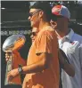  ?? MIKE EHRMANN / GETTY IMAGES FILES ?? Tom Brady celebrates with the Vince Lombardi Trophy on a boat parade through Tampa last month.