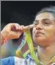  ??  ?? PV Sindhu with her Olympics silver medal for women’s singles (badminton)