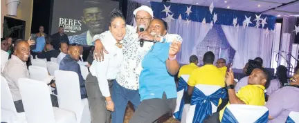  ??  ?? Guest artiste Beres Hammond was a joy to these two Hilton associates, who couldn’t get enough of him during their staff awards ceremony.
