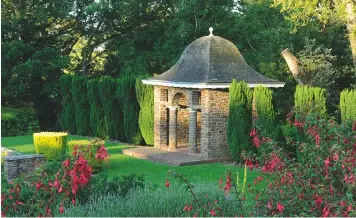  ??  ?? Over fuchsia and lavender hedges to the Toot, a 20th-century summer house at one end of the Bottom Terrace, flanked by unclipped Irish yew