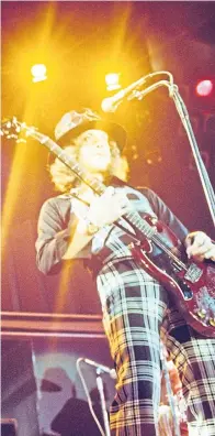  ??  ?? ● Back in the day: Dave Hill and Noddy Holder blast out Slade hits in the ’70s