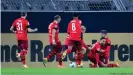  ??  ?? Ellyes Skhiri, second from right, leads the celebratio­ns after his second goal against Dortmund