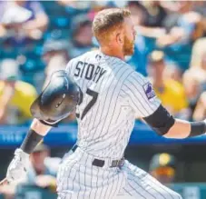  ?? Shaban Athuman, The Denver Post ?? Rockies shortstop Trevor Story was 2-for-4 on Wednesday but was stranded on third base in the eighth inning when Ian Desmond struck out and Chris Iannetta grounded out to end the threat.