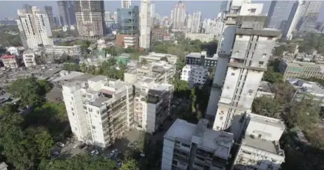  ??  ?? In the documentar­y project Universe Within, two Toronto researcher­s and a team of filmmakers examined how “digital citizens” are transformi­ng highrise communitie­s around the world, including Campa Cola in Mumbai.
