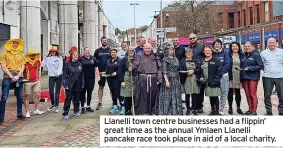  ?? ?? Llanelli town centre businesses had a flippin’ great time as the annual Ymlaen Llanelli pancake race took place in aid of a local charity.