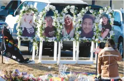  ?? DAVID ZALUBOWSKI/AP ?? Portraits of the victims killed in the attack are displayed Tuesday at a makeshift memorial in Colorado Springs, Colo. Seventeen others suffered gunshot wounds.