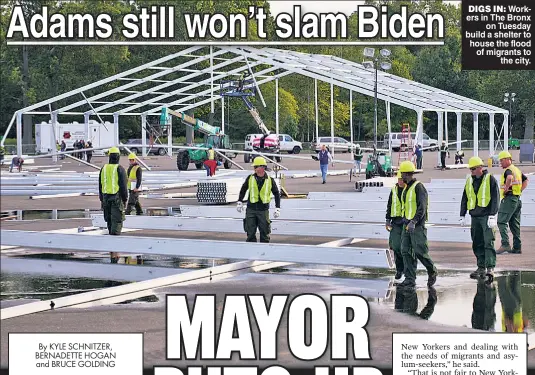  ?? ?? DIGS IN: Workers in The Bronx on Tuesday build a shelter to house the flood of migrants to the city.