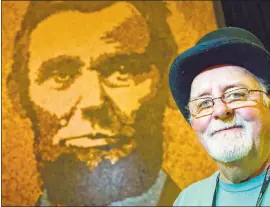  ?? CORY MORSE – THE ASSOCIATED PRESS ?? Richard Schlatter stands next to his entry “A. Lincoln” in Grand Rapids, Mich. Schlatter won the $200,000Public Vote Grand Prize for “A. Lincoln” during ArtPrize on Friday.