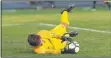  ?? AIMEE BIELOZER — FOR THE MORNING JOURNAL ?? Olmsted Falls goalkeeper Connor Ciolek makes a diving stop against Avon on Oct. 7.