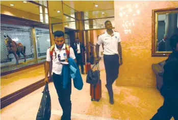  ??  ?? WINDIES ARE IN TOWN . . . Windies star Davendra Bishoo leads his captain Jason Holder as they make their way out of the Robert Gabriel Mugabe Internatio­nal Airport after their arrival in Harare last night for the ICC World Cup Qualifier