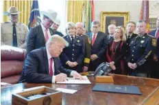  ?? — Reuters ?? President Donald Trump signs his veto of the congressio­nal resolution to end his emergency declaratio­n to get funds for a border wall.