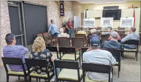  ?? Westside Eagle Observer/RANDY MOLL ?? Local residents and business owners attended an Oct. 26 meeting to hear of plans to renovate Gentry’s Main Street and make it a place where people will want to shop and spend time. Speaking to the group (standing in the front) were Janie Parks, director of Gentry’s chamber of commerce, and Kevin Johnston, Gentry’s mayor.