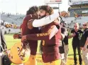  ??  ?? Arizona State quarterbac­k Manny Wilkins hugs N’Keal Harry after defeating Utah on Saturday at Sun Devil Stadium.