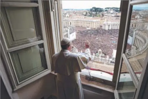  ?? Photo: GETTY IMAGES ?? BLESSED: Pope Francis delivers his Angelus prayer and blessing to the pilgrims gathered from the window of his studio overlookin­g St Peter’s Square on Sunday in Vatican City. The inaugurati­on mass of the first-ever Latin American pontiff will be held...