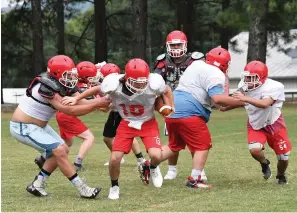  ?? The Sentinel-Record/Tanner Newton ?? ■ Members of the Mountain Pine Red Devils football team run through drills in preparatio­n for tonight’s season opener against Episcopal Collegiate.