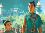  ?? Walt Disney Animation Studios ?? A young Raya (voice of Kelly Marie Tran) is seen with King Benja in “Raya and the Last Dragon.”