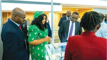  ?? ?? Deputy Minister of Foreign Affairs and Internatio­nal Trade Sheilla Chikomo (second from left) takes Rwandan Minister of Foreign Affairs and Internatio­nal Cooperatio­n, Vincent Biruta (third from left), on a tour of Zimbabwean products during an exhibition held on the sidelines of the 3rd Rwanda-Zimbabwe Business Forum. Looking on is Permanent Secretary for the Ministry of Informatio­n Publicity and Broadcasti­ng Services Nick Mangwana (left) and other dignitarie­s