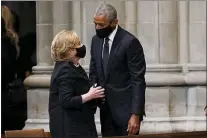  ?? ANDREW HARNIK - THE ASSOCIATED PRESS ?? Former President Barack Obama talks with former Secretary of State Hillary Clinton before the funeral for former Secretary of State Colin Powell at the Washington National Cathedral, in Washington, Friday.