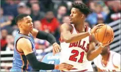  ?? AFP ?? Jimmy Butler of the Chicago Bulls looks to pass against the Oklahoma City Thunder’s Russell Westbrook on Monday.
